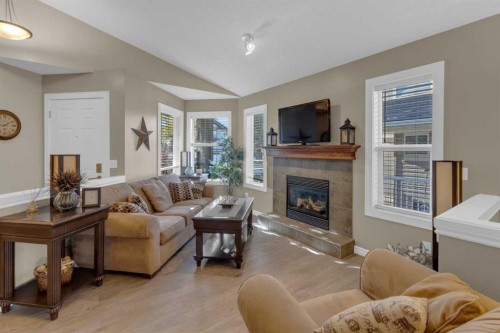 266 Canals Circle Sw, Airdrie, AB - Indoor Photo Showing Living Room With Fireplace