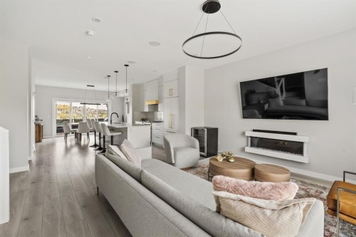 3048 85 Street Sw, Calgary, AB - Indoor Photo Showing Living Room With Fireplace