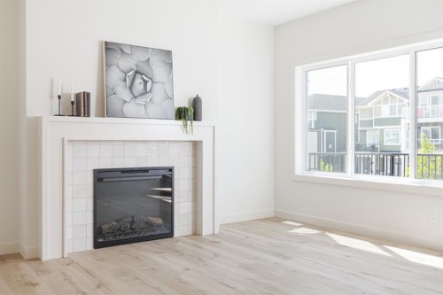 47 Sundown Crescent, Cochrane, AB - Indoor Photo Showing Living Room With Fireplace