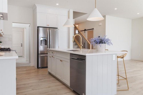 47 Sundown Crescent, Cochrane, AB - Indoor Photo Showing Kitchen With Upgraded Kitchen