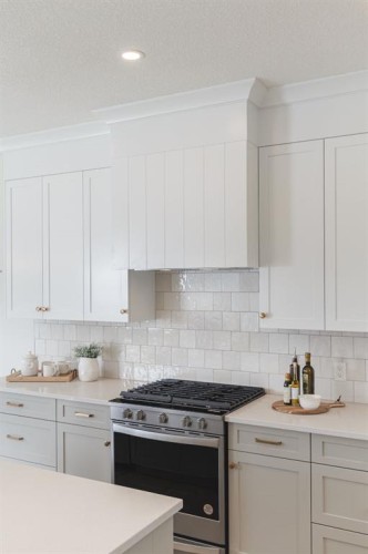 47 Sundown Crescent, Cochrane, AB - Indoor Photo Showing Kitchen With Upgraded Kitchen