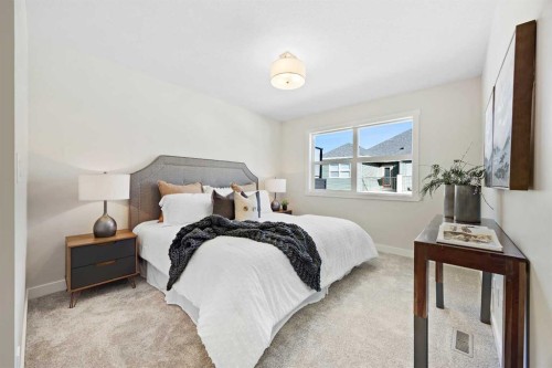 2150 Bayview Drive Sw, Airdrie, AB - Indoor Photo Showing Bedroom