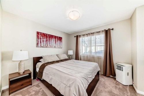 49 New Brighton Point Se, Calgary, AB - Indoor Photo Showing Bedroom