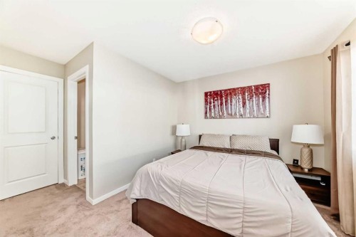 49 New Brighton Point Se, Calgary, AB - Indoor Photo Showing Bedroom
