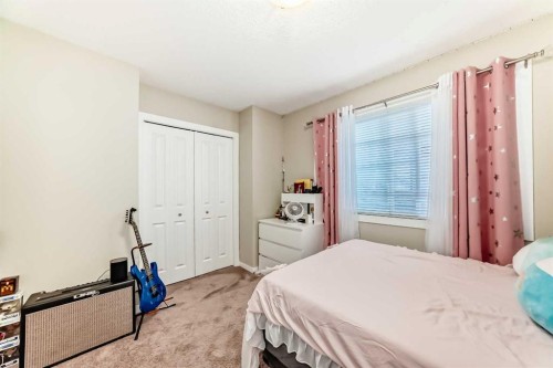 49 New Brighton Point Se, Calgary, AB - Indoor Photo Showing Bedroom