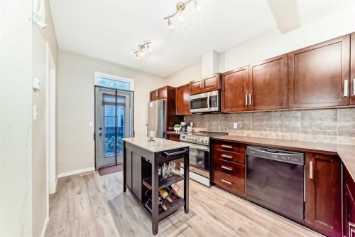 49 New Brighton Point Se, Calgary, AB - Indoor Photo Showing Kitchen