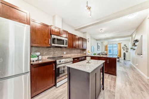 49 New Brighton Point Se, Calgary, AB - Indoor Photo Showing Kitchen With Double Sink