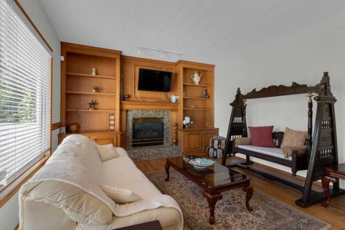 271 Mountain Park Drive Se, Calgary, AB - Indoor Photo Showing Living Room With Fireplace