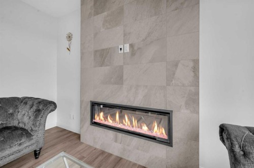 95 Redstone Heights Ne, Calgary, AB - Indoor Photo Showing Living Room With Fireplace