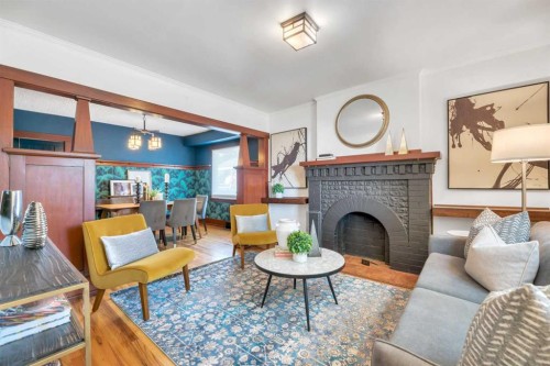 111 11 Avenue Nw, Calgary, AB - Indoor Photo Showing Living Room With Fireplace