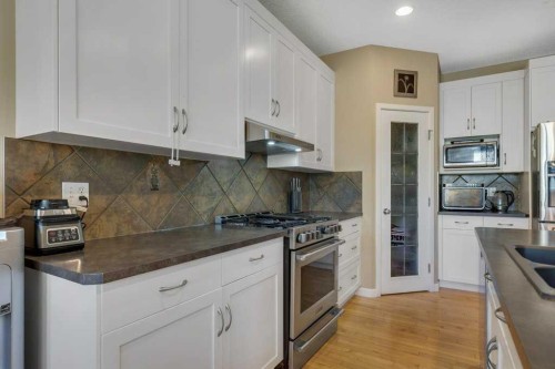 119 Valley Stream Circle Nw, Calgary, AB - Indoor Photo Showing Kitchen With Stainless Steel Kitchen With Double Sink With Upgraded Kitchen