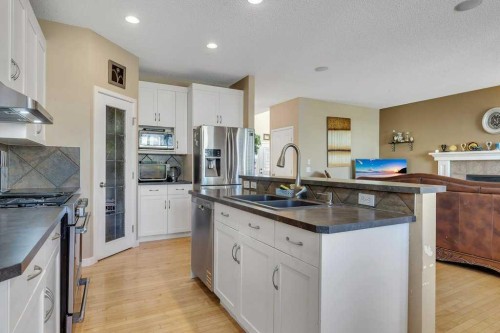 119 Valley Stream Circle Nw, Calgary, AB - Indoor Photo Showing Kitchen With Stainless Steel Kitchen With Double Sink With Upgraded Kitchen