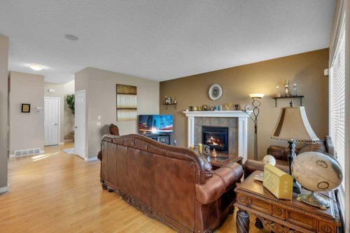 119 Valley Stream Circle Nw, Calgary, AB - Indoor Photo Showing Living Room With Fireplace
