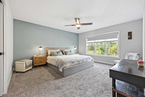 34 Coach Ridge Point Sw, Calgary, AB - Indoor Photo Showing Bedroom