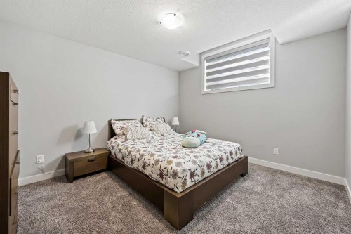 34 Coach Ridge Point Sw, Calgary, AB - Indoor Photo Showing Bedroom