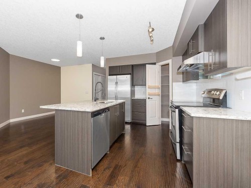 202-15207 1 Street Se, Calgary, AB - Indoor Photo Showing Kitchen With Upgraded Kitchen