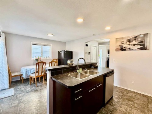 43 Bridlecrest Road Sw, Calgary, AB - Indoor Photo Showing Kitchen With Double Sink