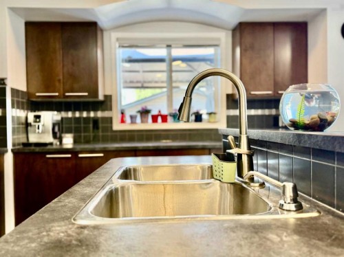 43 Bridlecrest Road Sw, Calgary, AB - Indoor Photo Showing Kitchen With Double Sink