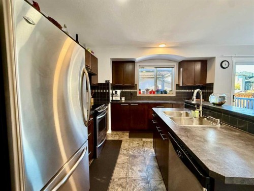 43 Bridlecrest Road Sw, Calgary, AB - Indoor Photo Showing Kitchen With Stainless Steel Kitchen With Double Sink