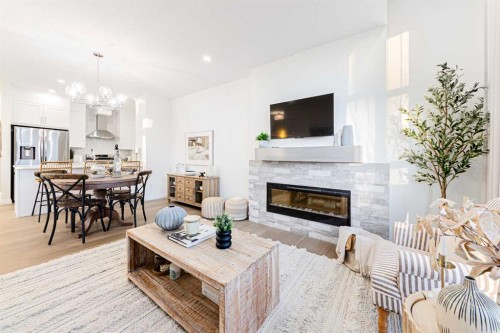 2166 Bayview Drive Sw, Airdrie, AB - Indoor Photo Showing Living Room With Fireplace