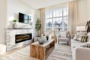 2166 Bayview Drive Sw, Airdrie, AB  - Indoor Photo Showing Living Room With Fireplace 