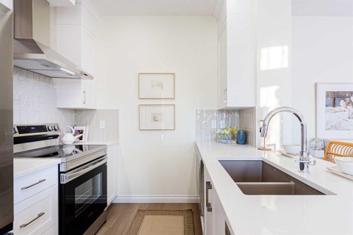 2166 Bayview Drive Sw, Airdrie, AB - Indoor Photo Showing Kitchen With Double Sink