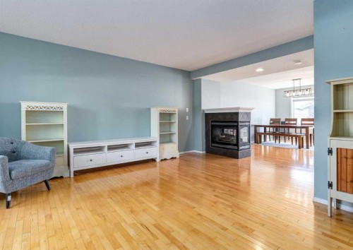 137 Tuscany Springs Way Nw, Calgary, AB - Indoor Photo Showing Living Room With Fireplace