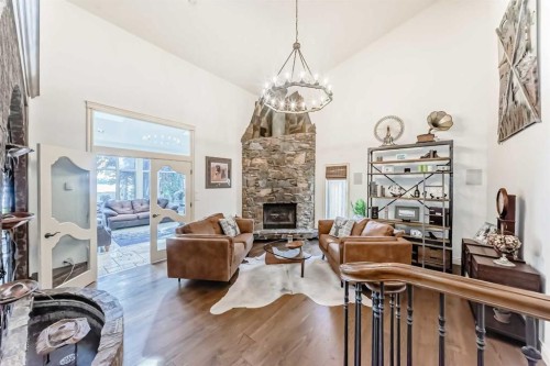716 West Chestermere Drive, Chestermere, AB - Indoor Photo Showing Living Room With Fireplace
