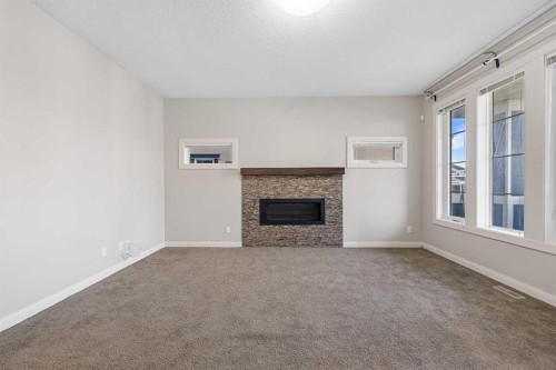 53 Redstone Villas Ne, Calgary, AB - Indoor With Fireplace