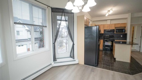 202-8 Prestwick Pond Terrace Se, Calgary, AB - Indoor Photo Showing Kitchen