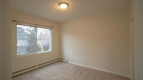 202-8 Prestwick Pond Terrace Se, Calgary, AB - Indoor Photo Showing Bedroom