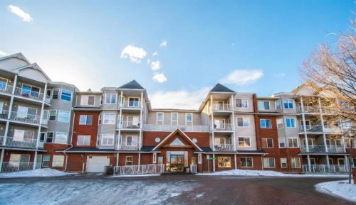 202-8 Prestwick Pond Terrace Se, Calgary, AB - Indoor Photo Showing Living Room
