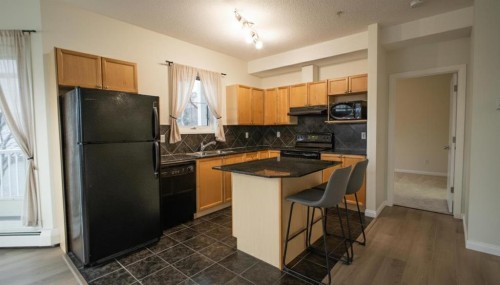 202-8 Prestwick Pond Terrace Se, Calgary, AB - Indoor Photo Showing Kitchen