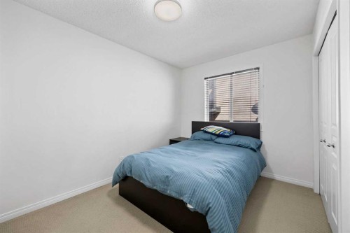83 Aspen Stone Terrace Sw, Calgary, AB - Indoor Photo Showing Bedroom