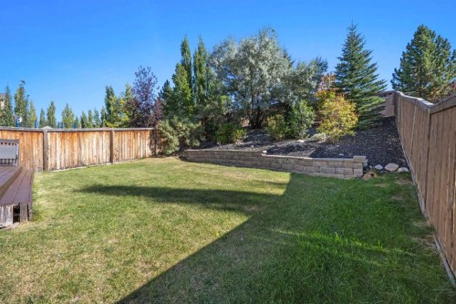 83 Aspen Stone Terrace Sw, Calgary, AB - Outdoor With Backyard