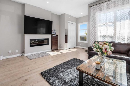 44 Calhoun Common Ne, Calgary, AB - Indoor Photo Showing Living Room With Fireplace