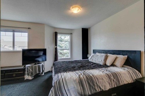 51 Spring Meadows Bay, Okotoks, AB - Indoor Photo Showing Bedroom
