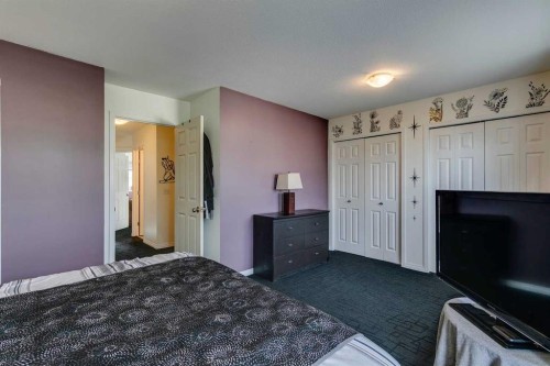 51 Spring Meadows Bay, Okotoks, AB - Indoor Photo Showing Bedroom