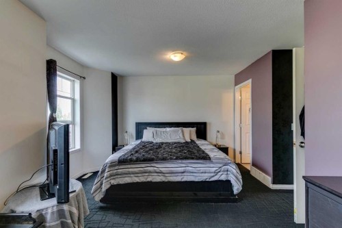 51 Spring Meadows Bay, Okotoks, AB - Indoor Photo Showing Bedroom