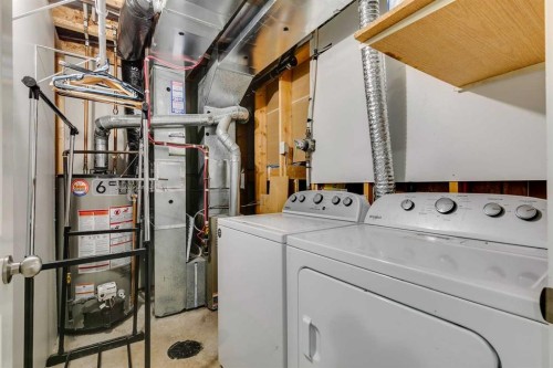 51 Spring Meadows Bay, Okotoks, AB - Indoor Photo Showing Laundry Room