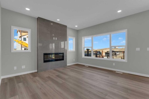 69 Silver Spruce Road Sw, Calgary, AB - Indoor Photo Showing Living Room With Fireplace