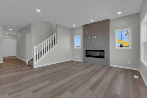 69 Silver Spruce Road Sw, Calgary, AB - Indoor Photo Showing Living Room With Fireplace