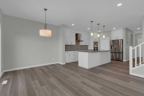 69 Silver Spruce Road Sw, Calgary, AB - Indoor Photo Showing Kitchen With Upgraded Kitchen