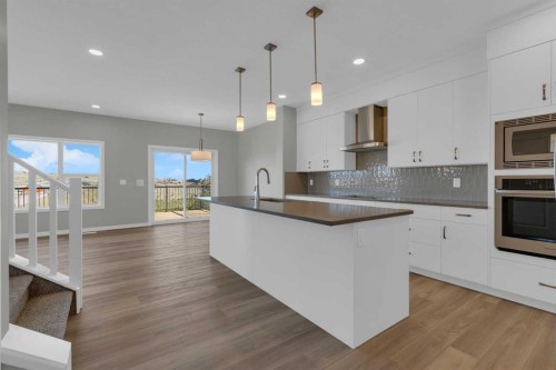 69 Silver Spruce Road Sw, Calgary, AB - Indoor Photo Showing Kitchen With Upgraded Kitchen