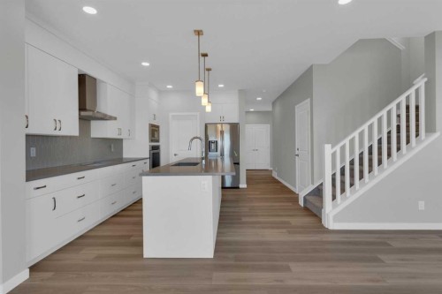 69 Silver Spruce Road Sw, Calgary, AB - Indoor Photo Showing Kitchen With Upgraded Kitchen
