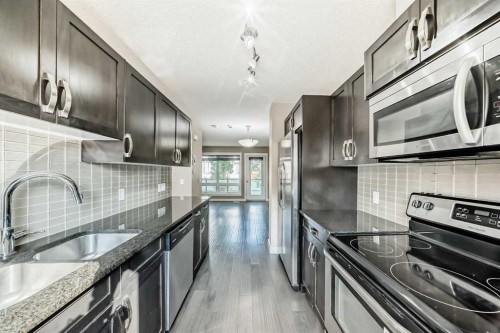 326 Covecreek Circle Ne, Calgary, AB - Indoor Photo Showing Kitchen With Stainless Steel Kitchen With Double Sink With Upgraded Kitchen