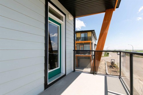 209-414 Seton Passage Se, Calgary, AB - Outdoor With Balcony With Exterior