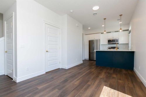 209-414 Seton Passage Se, Calgary, AB - Indoor Photo Showing Kitchen