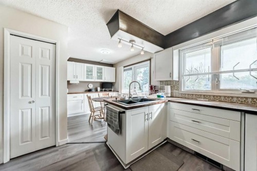 15 Whitewood Bay Ne, Calgary, AB - Indoor Photo Showing Kitchen With Double Sink