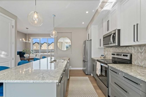 332 Lawthorn Way Se, Airdrie, AB - Indoor Photo Showing Kitchen With Upgraded Kitchen